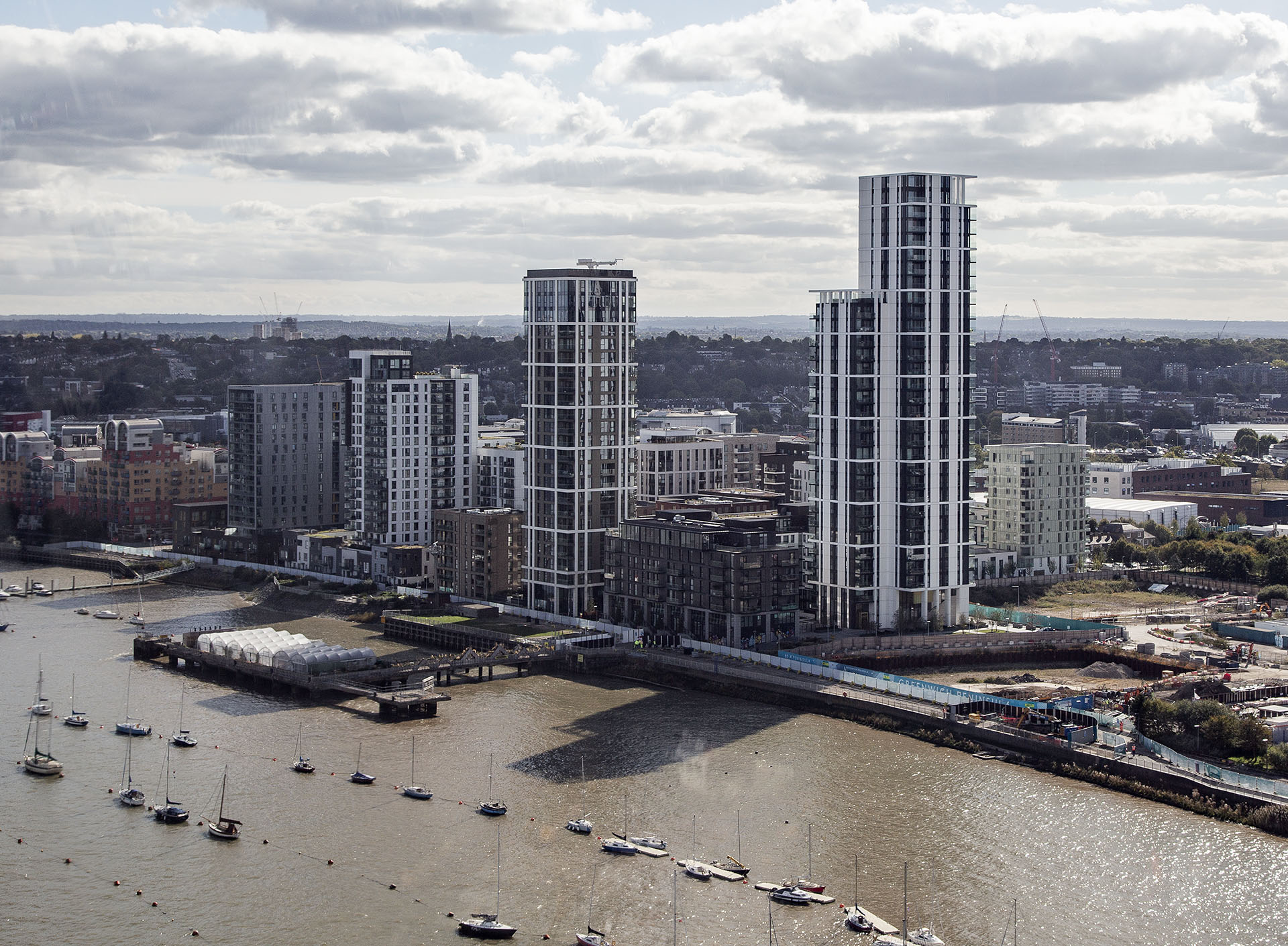 The Waterman and Lighterman buildings as seen from cable car crossing the river Thames in foreground